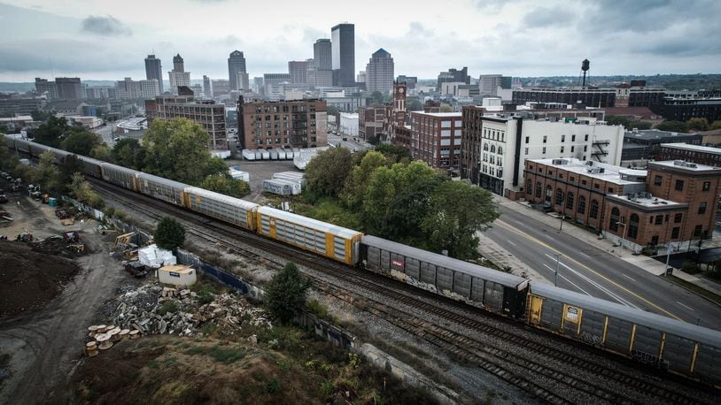 A freight train moves through Dayton near East Third Street September29, 2023. JIM NOELKER/STAFF