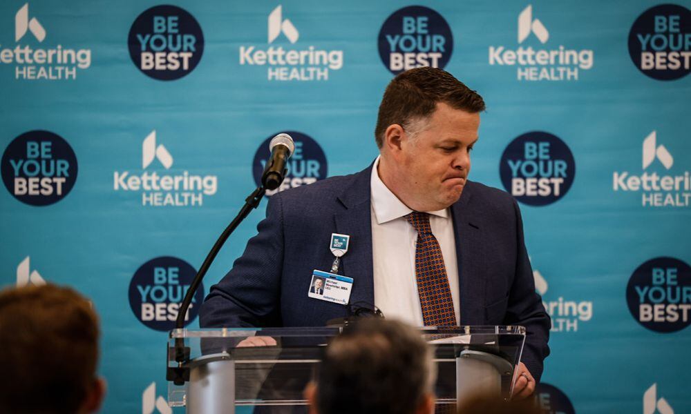 File - Michael Mewhirter, who was Kettering Health interim CEO at the time, finishes his remarks before a ribbon cutting ceremony at the new Kettering Health Centerville Health Center on Friday, Jan. 27, 2023. Mewhirter later transitioned into the role of chief administrative officer and will now be leaving the network in April. JIM NOELKER/STAFF