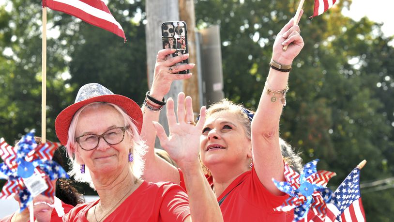 Blue Star mothers wave to the crowd on Saturday, Sept. 23, 2023, during the Grape Jamboree Parade in Geneva, Ohio. (Warren Dillaway/The Star-Beacon via AP)
