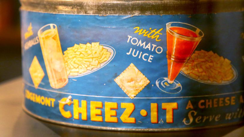 The Cheez-It cracker was invented in Dayton in 1921 by the Greene & Greene Company. This snack can, circa 1929, is on display at Carillon Historical Park.  LISA POWELL / DAYTON DAILY NEWS