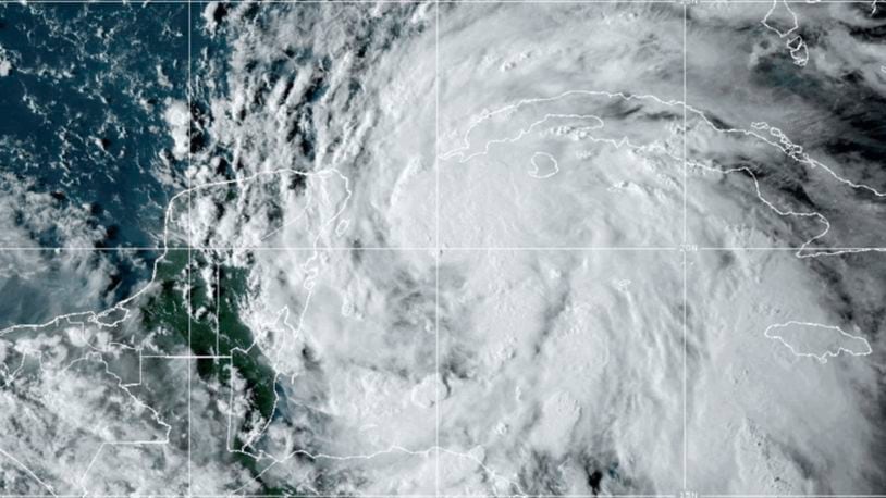 This National Oceanic and Atmospheric Administration satellite image taken at 6:10pm ET shows Tropical Storm Helene off the Gulf Coast of Florida near Mexico and Cuba on Tuesday, Sept. 24, 2024. (NOAA via AP)