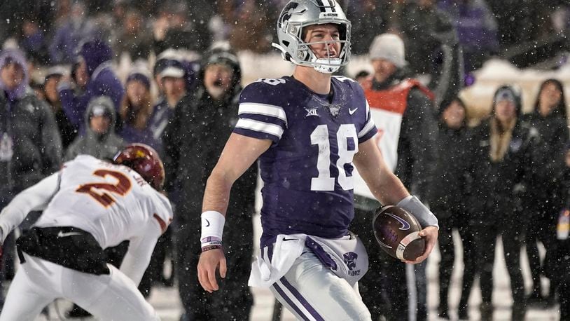 Kansas State quarterback Will Howard scores a touchdown during the second half of an NCAA college football game against Iowa State Saturday, Nov. 25, 2023, in Manhattan, Kan. (AP Photo/Charlie Riedel)