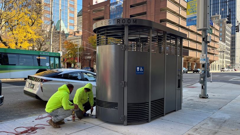 Crews install a new Portland Loo standalone restroom by City Hall at West Third and North Ludlow streets. CORNELIUS FROLIK / STAFF