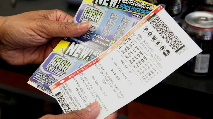 Dyan Gibbons (cq) of Dayton purchased Powerball tickets at the independent gas station at the corner of Woodman and Linden on Wednesday, May 15, 2013. "I'm just trying to make an easy dollar," Gibbons said. TY GREENLEES / STAFF