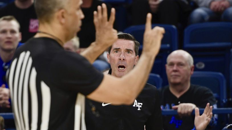 Air Force coach Joe Scott, center, argues with an official after Beau Becker was called for a technical foul against Colorado State during a NCAA college basketball game in the Mountain West Conference finale on Saturday, March 9, 2024, in Colorado Springs, Colo. (Carson Field/The Gazette via AP)