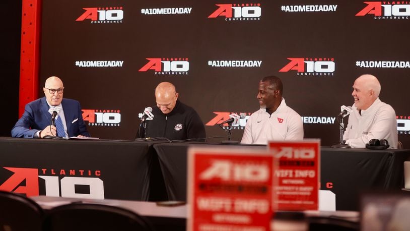 ESPN's Seth Greenberg moderates a panel discussion with Frank Martin, of Massachusetts, Dayton's Anthony Grant and St. Bonaventure's Mark Schmidt at Atlantic 10 Conference Media Day on Monday, Oct. 7, 2024, at District E next to Capital One Arena in Washington, D.C. David Jablonski/Staff