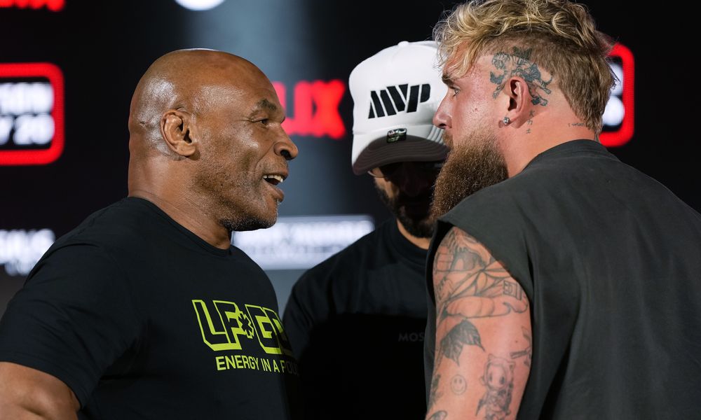 FILE - Mike Tyson, left, and Jake Paul, right, face off during a news conference promoting their upcoming boxing bout, May 16, 2024, in Arlington, Texas. (AP Photo/Sam Hodde, File)