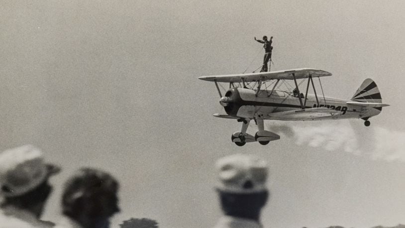 Patty Wagner on wing of plane with husband Bob as pilot during the 1975 Dayton Air Fair. COURTESY OF WRIGHT STATE UNIVERSITY, DAYTON DAILY NEWS ARCHIVE