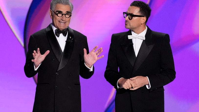 Hosts Eugene Levy and Dan Levy speak during the 76th Primetime Emmy Awards on Sunday, Sept. 15, 2024, at the Peacock Theater in Los Angeles. (AP Photo/Chris Pizzello)