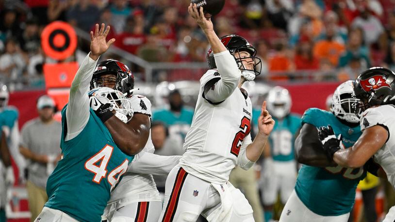 Tampa Bay Buccaneers quarterback Kyle Trask (2) aims a pass during the first half of a pre season NFL football game against the Miami Dolphins, Friday, Aug. 23, 2024, in Tampa, Fla. (AP Photo/Jason Behnken)