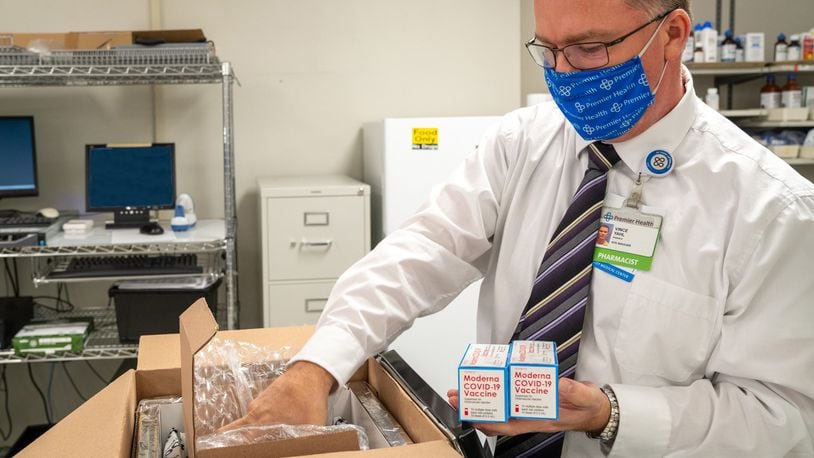 Upper Valley Medical Center in Troy received 600 doses of the Moderna coronavirus vaccine Monday morning. Vince Yahl, the pharmacy site manager at Upper Valley, unpacks the doses. JIM NOELKER/STAFF