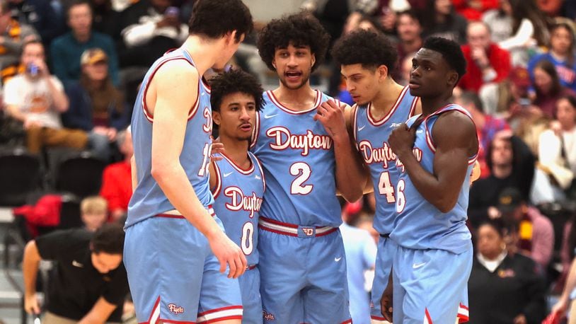 Dayton players huddle during a game against Loyola Chicago on Friday, March 1, 2024, at Gentile Arena in Chicago. David Jablonski/Staff