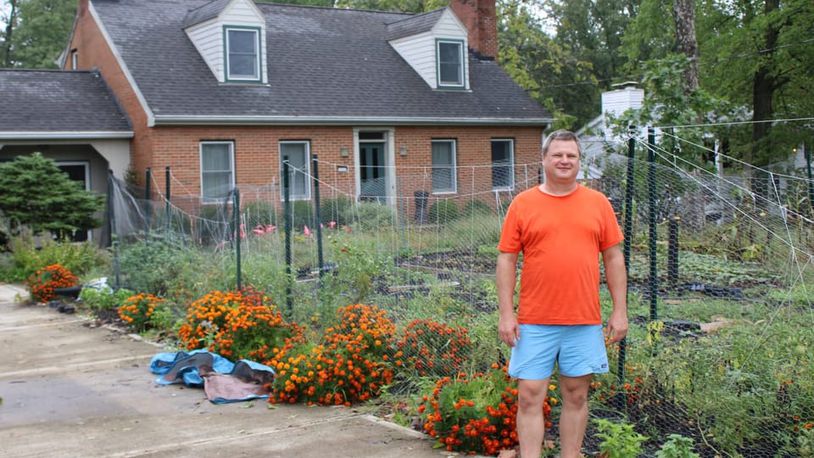 Jon Ralinovsky stands next to the garden Mary-Kate Huddleston made for him after the prairie project. AUSTIN SMITH/OXFORD FREE PRESS