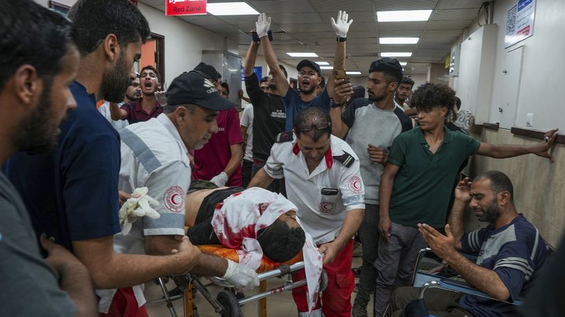 Palestinians wounded in the Israeli bombardment of the Gaza Strip are brought to Al Aqsa hospital in Deir al Balah, Gaza Strip, Tuesday, Thursday, May 23, 2024. (AP Photo/Abdel Kareem Hana)