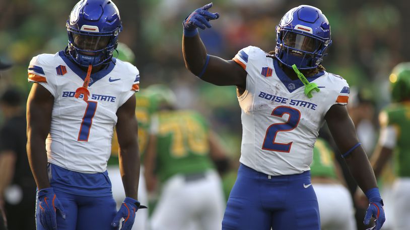 Boise State running backs Jambres Dubar (1) and Jeanty (2) dance during warmups before an NCAA college football game against Oregon, Saturday, Sept. 7, 2024, at Autzen Stadium in Eugene, Ore. (AP Photo/Lydia Ely)