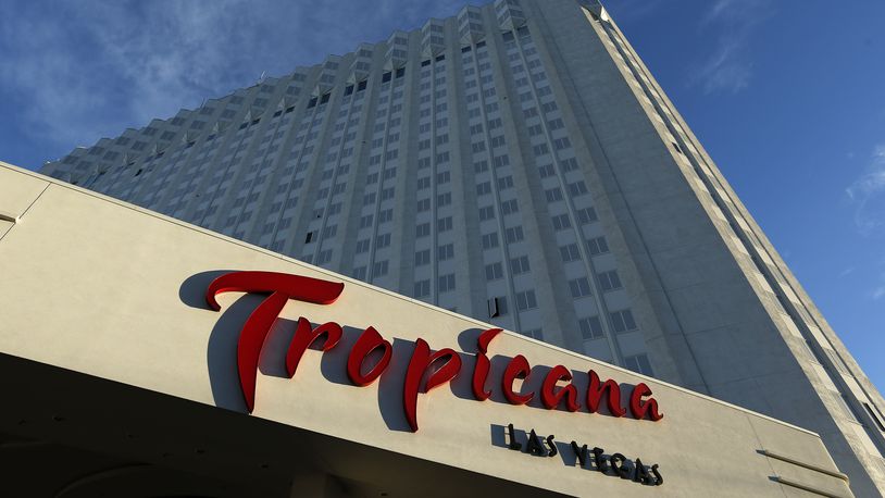 FILE - Sunlight illuminates a sign at the Tropicana hotel and casino on Aug. 4, 2015, in Las Vegas. (AP Photo/John Locher, File)