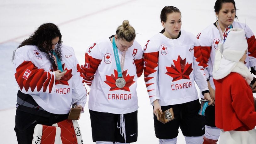 Jocelyne Larocque holds her silver medal after quickly taking it off her neck after Canada lost to the USA.