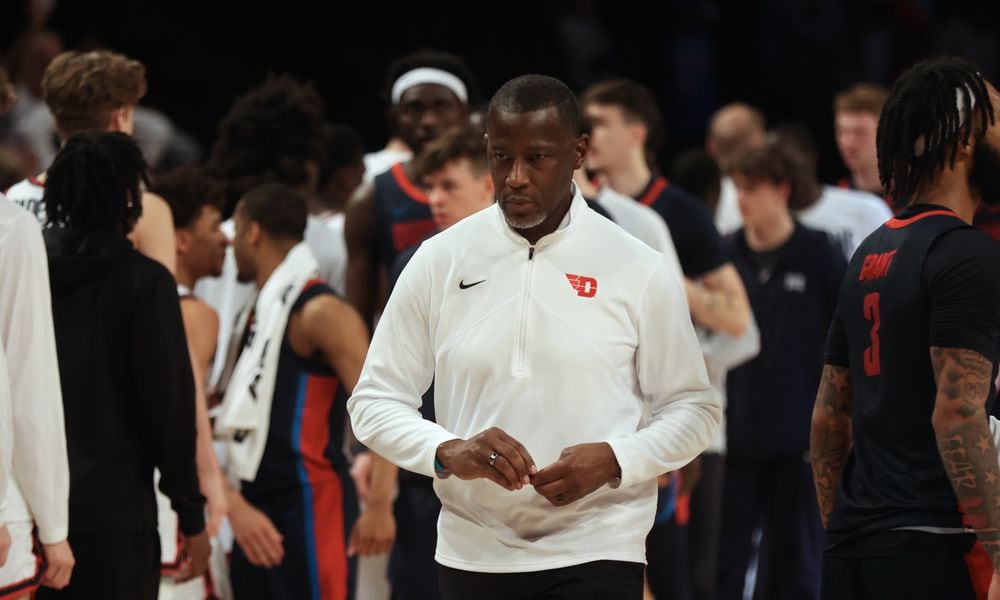 Dayton's Anthony Grant leaves the court after a loss to Duquesne in the Atlantic 10 Conference tournament quarterfinals on Thursday, March 14, 2024, at the Barclays Center in Brooklyn, N.Y. David Jablonski/Staff