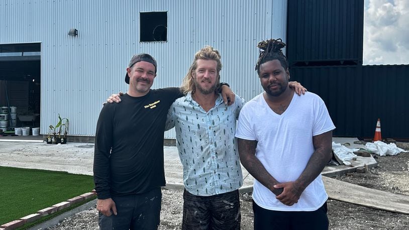 Chef Dane Shipp is opening a new concept at The Silos, a food hall and beer garden expected to open in the fall near 2nd Street Market in downtown Dayton. Pictured (left to right) are food hall owners Shannon Thomas and Wes Hartshorn with Chef Dane Shipp (CONTRIBUTED PHOTO).