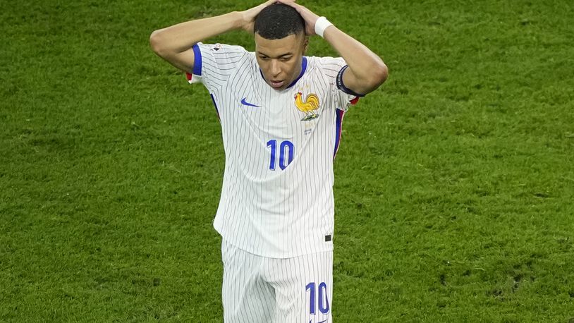 Kylian Mbappe of France reacts after missing a chance to score during a semifinal match between Spain and France at the Euro 2024 soccer tournament in Munich, Germany, Tuesday, July 9, 2024. (AP Photo/Ebrahim Noroozi)
