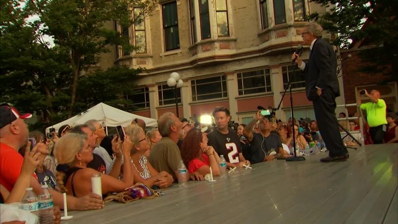 The crowd at an Oregon District vigil after 2019's mass shooting urges Ohio Gov. Mike DeWine to "do something" about gun violence.