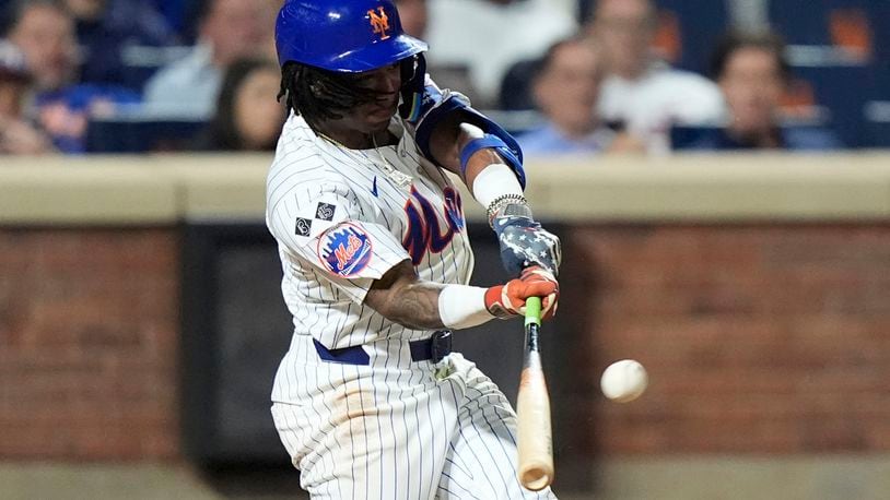 New York Mets' Luisangel Acuna hits a home run during the eighth inning of a baseball game against the Washington Nationals, Tuesday, Sept. 17, 2024, in New York. (AP Photo/Frank Franklin II)