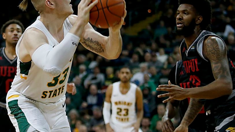 Wright State University center Loudon Love looks to shoot against IUPUI forward Elyjah Goss during their Horizon League game at the Nutter Center in Fairborn Sunday, Feb. 16, 2020. Wright State won 106-66. Contributed photo by E.L. Hubbard