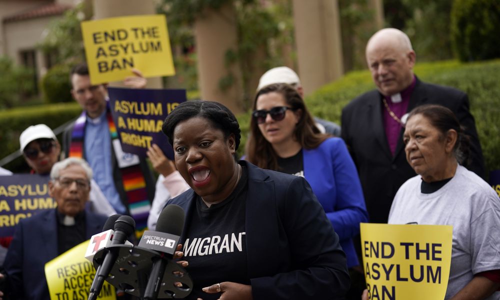 Guerline Jozef, Executive Director of the Haitian Bridge Alliance, speaks in front of demonstrators outside of the Richard H. Chambers U.S. Court of Appeals ahead of an asylum hearing, Tuesday, Nov. 7, 2023, in Pasadena, Calif. (AP Photo/Marcio Jose Sanchez)