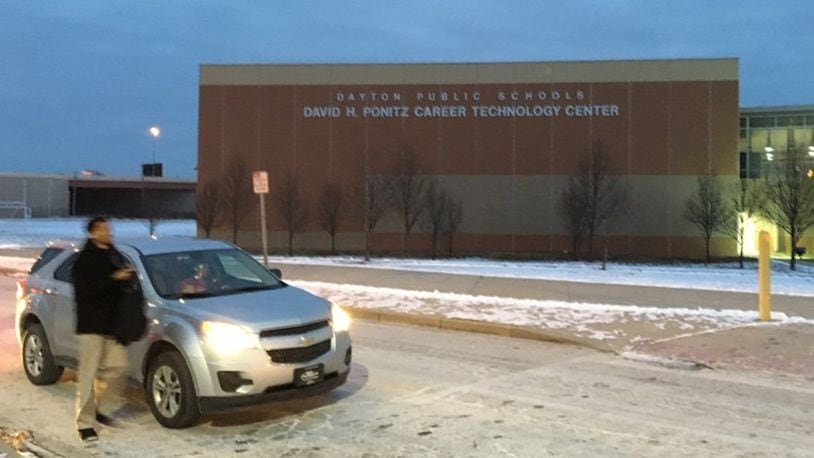 A student is dropped off for class Monday morning at Ponitz Career Technology Center in Dayton. Dayton Public Schools officials were trying to figure out a way to transport high school students who relied on RTA buses, which were idled this week because of a union strike. The state only requires schools to transport students in kindergarten through eighth grade.