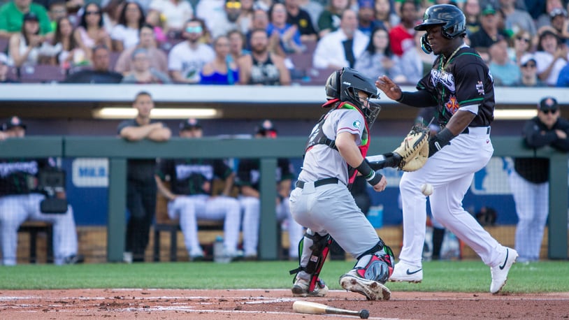 Dayton's Hector Rodriguez scores a run earlier this season at Day Air Ballpark. On Thursday night, Rodriguez collected the game-winning hit. Jeff Gilbert/CONTRIBUTED