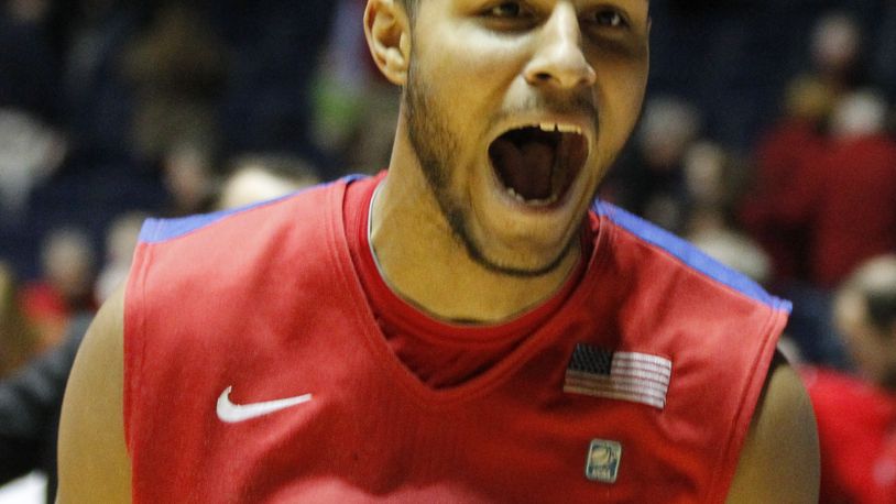 Dayton forward Devin Oliver celebrates after his game-winning 3-pointer against Ole Miss with 0.3 to play in overtime on Saturday, Jan. 4, 2014, in Oxford, Miss. David Jablonski/Staff