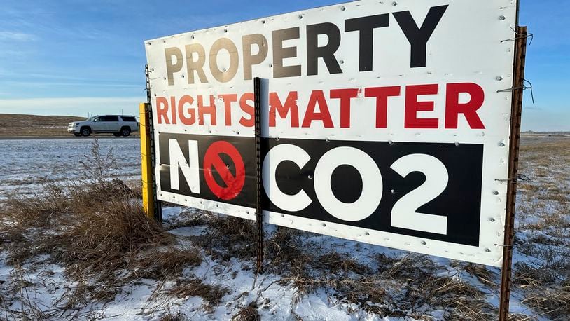 A sign reading "Property rights matter, no CO2" stands near Strasburg, N.D., Jan. 11, 2024. Iowa public utility regulators on Tuesday, June 25, 2024 gave approval for a controversial carbon dioxide pipeline proposed for the Midwest, but the company will has many hoops to jump through before it can begin construction. (AP Photo/Jack Dura)