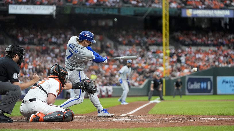 Kansas City Royals' Bobby Witt Jr. (7) hits in an RBI single during the sixth inning of Game 1 of an AL Wild Card Series baseball game against the Baltimore Orioles, Tuesday, Oct. 1, 2024, in Baltimore. (AP Photo/Stephanie Scarbrough)