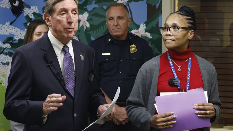 Montgomery County County Prosecutor Mat Heck, left, Dayton Police Department Maj. Brian Johns and Sgt. Roberta Bailey discuss Project Comfort, Wednesday, Oct. 2, 2024 at the Family Justice Center. The program is aimed at helping domestic survivors and their childern. MARSHALL GORBY\STAFF