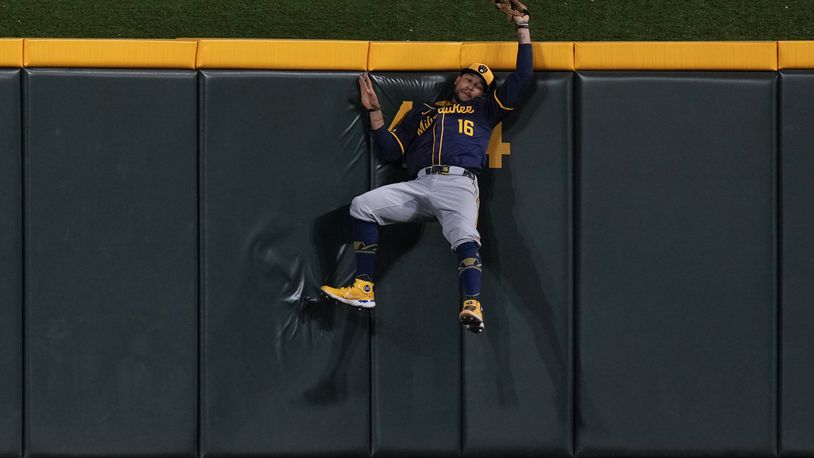 Milwaukee Brewers center fielder Blake Perkins catches a ball hit by Cincinnati Reds' Noelvi Marte during the sixth inning of a baseball game, Saturday, Aug. 31, 2024, in Cincinnati. (AP Photo/Carolyn Kaster)