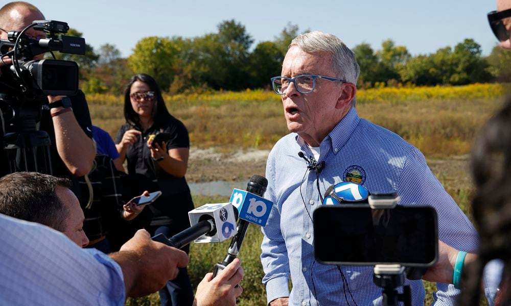 Governor Mike DeWine speaks with members of local, state and national media about Springfield and how Donald Trump mentioned the city during the debate Wednesday, Sept. 11, 2024 during a tour of the H2Ohio Rainbow Run Wetland located on Old Clifton Road in Clark County. BILL LACKEY/STAFF