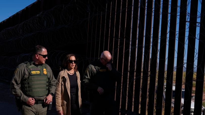 Democratic presidential nominee Vice President Kamala Harris talks with John Modlin, the chief patrol agent for the Tucson Sector of the U.S. Border Patrol, right, and Blaine Bennett, the U.S. Border Patrol Douglas Station border patrol agent in charge, as she visits the U.S. border with Mexico in Douglas, Ariz., Friday, Sept. 27, 2024. (AP Photo/Carolyn Kaster)