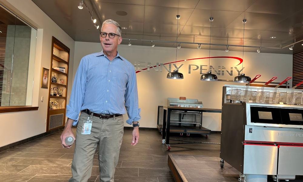 Rob Connelly, executive chairman of Henny Penny, gives guests a tour of one of the company's buildings off U.S. 35 in Eaton. THOMAS GNAU/STAFF