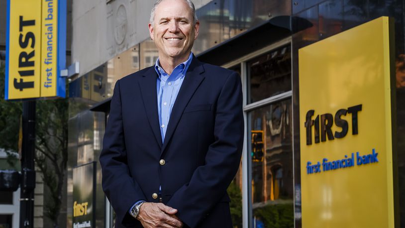 First Financial Bank CEO Archie Brown stands outside the Hamilton branch on High Street built in 1930. The bank is celebrating its 160th anniversary. NICK GRAHAM/STAFF