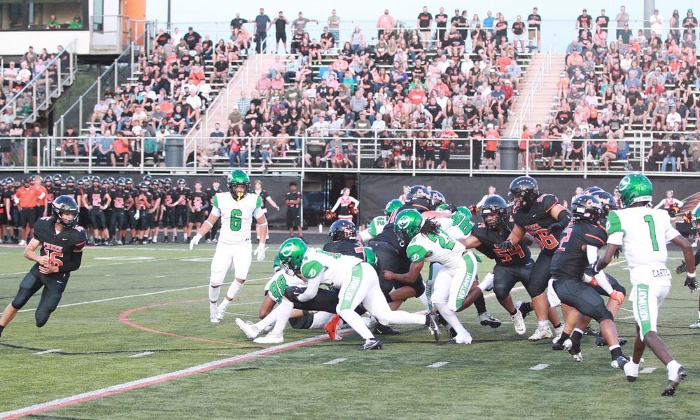 Northmont defense stops Beavercreek's Zane Piatt. Marcus Hartman/STAFF