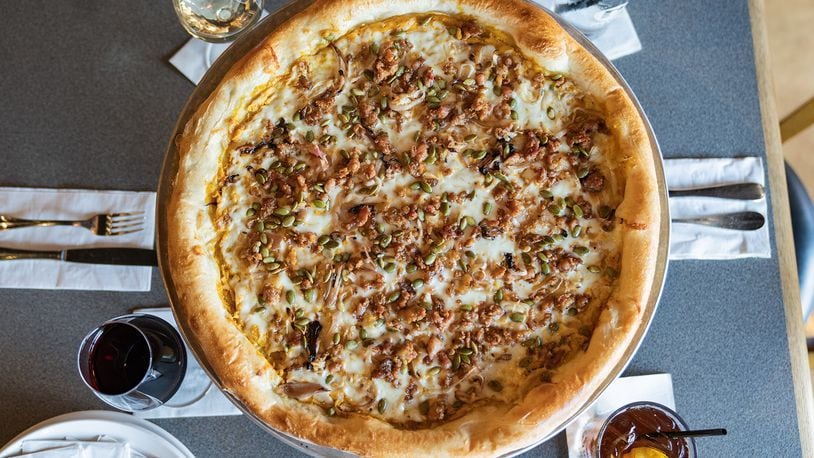 Dewey’s Pizza has brought back its seasonal Smashing Pumpkin pizza featuring whipped pumpkin ricotta base, mozzarella, crumbled Italian sausage, roasted shallots and toasted pumpkin seeds (CONTRIBUTED PHOTO).