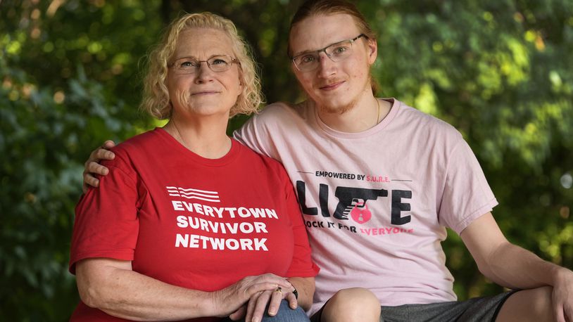 Denise Wieck and her son Guy Boyd, who was shot in the eye with a ghost gun, pose in Ypsilanti, Mich., Saturday, Sept. 14, 2024. (AP Photo/Paul Sancya)