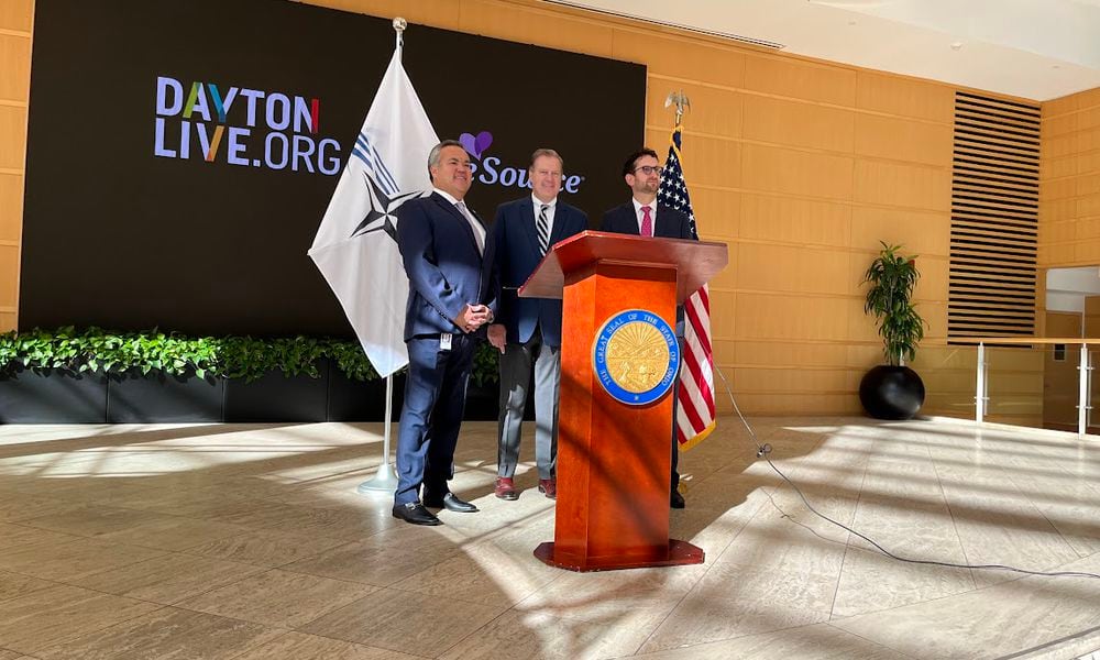 U.S. Rep. Mike Turner, R-Dayton, center, after discussing plans Wednesday for next May's expected NATO Spring Parliamentary Assembly visit to Dayton. On Turner's right: Erhardt Preitauer, president and CEO of CareSource. On his left, Gabriel van Aalst, president and CEO of Dayton Live. THOMAS GNAU/STAFF