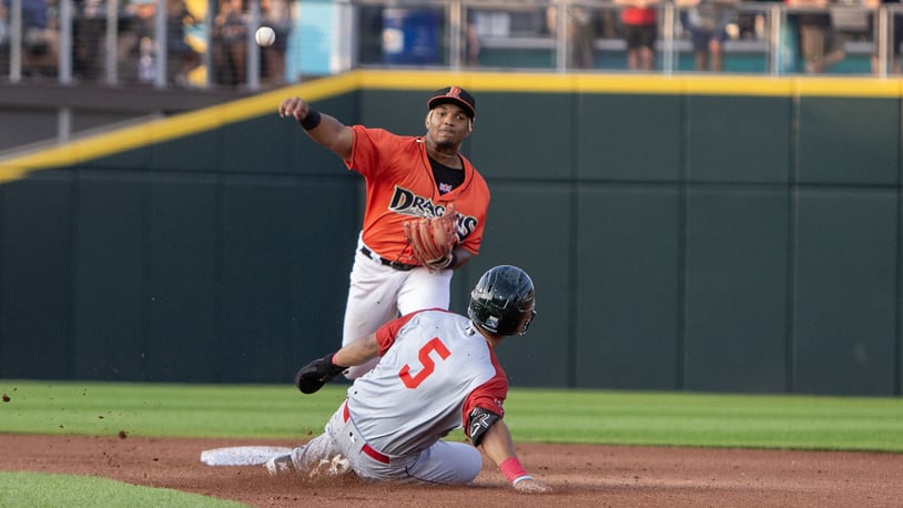 Dayton second baseman Victor Acosta turns a double play to end the fourth inning against Fort Wayne on Friday night at Day Air Ballpark. Jeff Gilbert/CONTRIBUTED