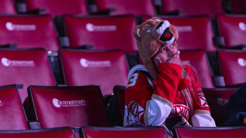 A Florida Panthers fan reacts during a watch party for Game 6 of the NHL hockey Stanley Cup Final between the Panthers and the Edmonton Oilers, Friday, June 21, 2024, in Sunrise, Fla. The Oilers won 5-1 to even the series. (Matias J. Ocner/Miami Herald via AP)