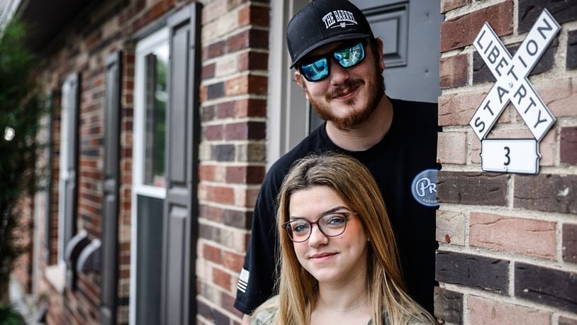 Elizabeth Palmer and Lane Prunty are moving from an apartment in Carlisle to a home in New Lebanon. JIM NOELKER/STAFF