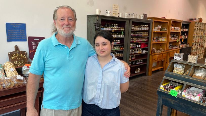 Maria’s Unique Foods has opened a second location at The Greene in Beavercreek after operating as a vendor at Dayton’s 2nd Street Market for nearly 12 years. Pictured is owner Michael Allen and his daughter, Alejandra Espinoza Allen. NATALIE JONES/STAFF