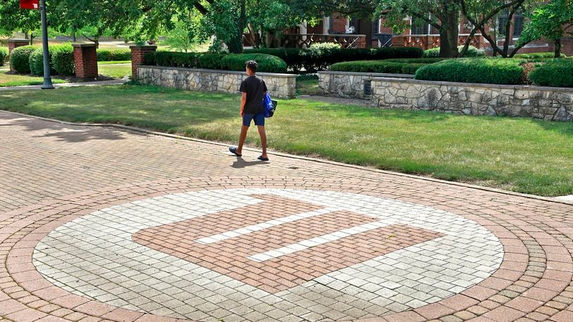 A man walks across the campus of Wittenberg University on Thursday, August 1, 2024. BILL LACKEY/STAFF