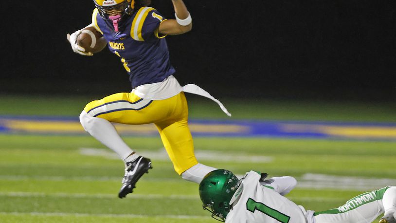 Springfield's Da'Shawn Martin tries to avoid a tackle by Northmont's Santana Keys during Friday's game. BILL LACKEY/STAFF