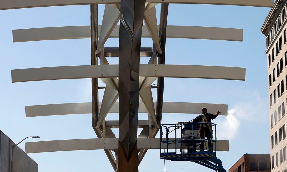 The Restoration of Wright Brothers Flyover Sculpture/Site on Main Street in downtown Dayton is underway. Phase 1 for 2024 includes general cleaning of the sculpture, replacing the current, non-operable lighting to LED fixtures, adding a landscape plan and repair/replace irrigation system for long-term care, and install new plaques that tell the history and feature the project partners/sponsors. MARSHALL GORBY\STAFF 